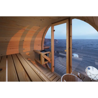 Outdoor Barrel Sauna Crafted for Wellness Retreats, Cedar Wood Construction, Glass Door, Six Person Capacity